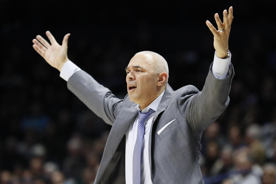 FILE - In this Feb. 9, 2019, file photo, DePaul head coach Dave Leitao reacts during the second half of an NCAA college basketball game, in Cincinnati. The NCAA suspended men’s basketball coach Dave Leitao for the first three games of the regular season Tuesday, July 23, 2019, saying he should have done more to prevent recruiting violations by his staff. The NCAA also put the Big East program on three years of probation, issued a $5,000 fine and said an undetermined number of games will be vacated because DePaul put an ineligible player on the floor. An unidentified former associate head coach is also facing a three-year show cause order for his role in the violations.(AP Photo/John Minchillo, File)