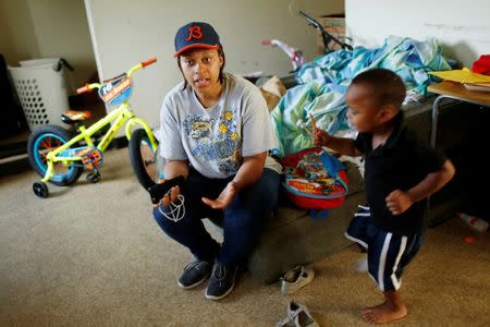 A'Kendra Erving speaks to a reporter in her home with her son, King Erving, 3, in East Chicago, Indiana, U.S. September 16, 2016. REUTERS/Michelle Kanaar