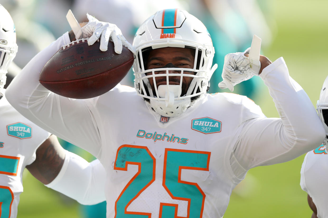 DENVER, COLORADO - NOVEMBER 22:  Xavien Howard #25 of the Miami Dolphins celebrates his interception during the first quarter against the Denver Broncos at Empower Field At Mile High on November 22, 2020 in Denver, Colorado. (Photo by Matthew Stockman/Getty Images)