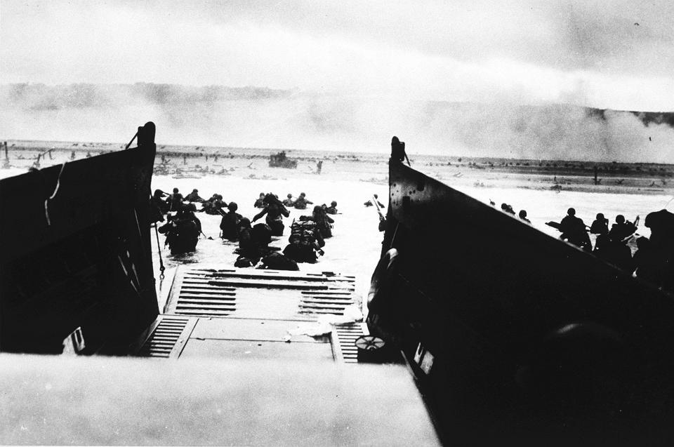 Americans go ashore during the invasion of France on June 6. 1944. Waves and waves of men swept Normandy shore. 