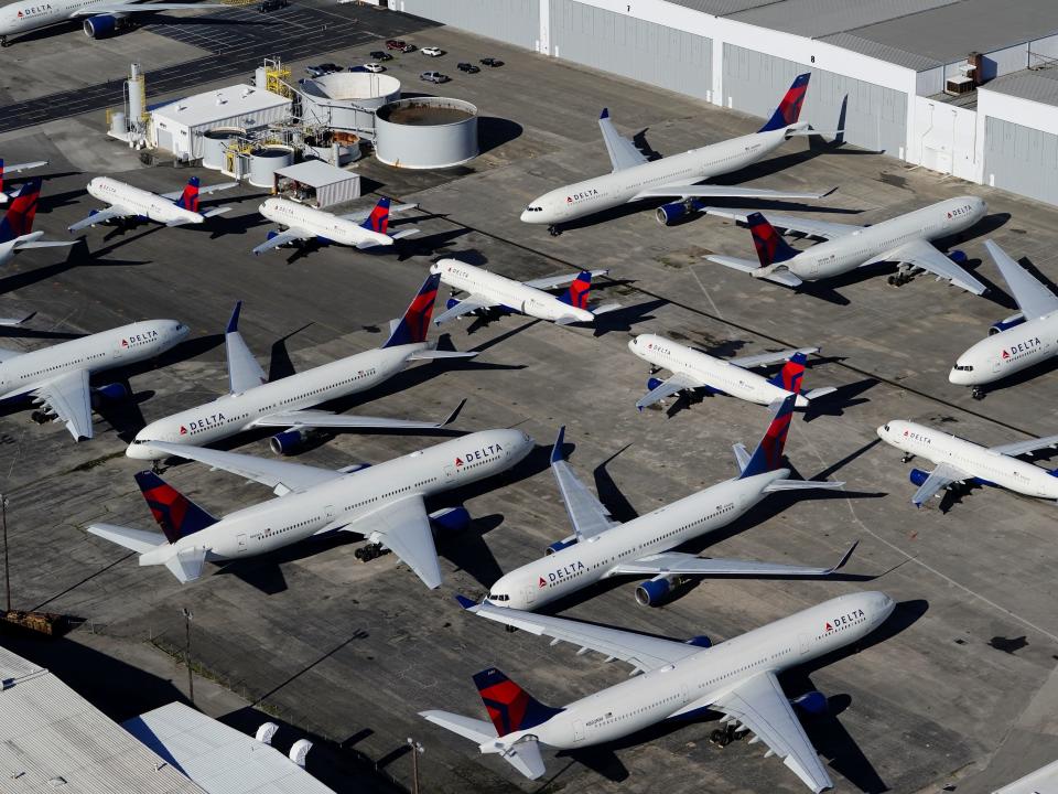 FILE PHOTO: Delta Air Lines passenger planes are seen parked due to flight reductions made to slow the spread of coronavirus disease (COVID-19), at Birmingham-Shuttlesworth International Airport in Birmingham, Alabama, U.S. March 25, 2020.  REUTERS/Elijah Nouvelage