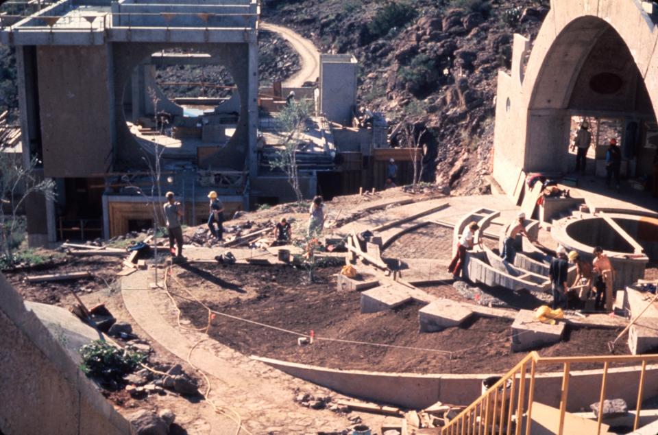 Arcosanti residents landscape for the lawn in front of the Ceramics Apse, ca. 1974–75.