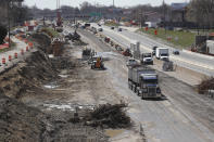 FILE - In this April 20, 2020, file photo work continues on the Interstate Highway 75 project in Hazel Park, Mich. Looking beyond the $1.9 trillion COVID relief bill, President Joe Biden and lawmakers are laying the groundwork for another of his top legislative priorities — a long-sought boost to the nation's roads, bridges and other infrastructure that could meet GOP resistance to a hefty price tag. (AP Photo/Carlos Osorio, File)