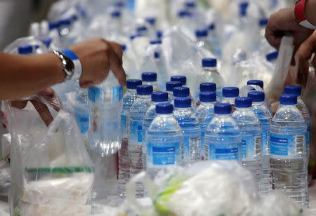 Plastic bags and bottles are given out during an event in Singapore, April 28, 2018. Picture taken April 28, 2018. REUTERS/Feline Lim