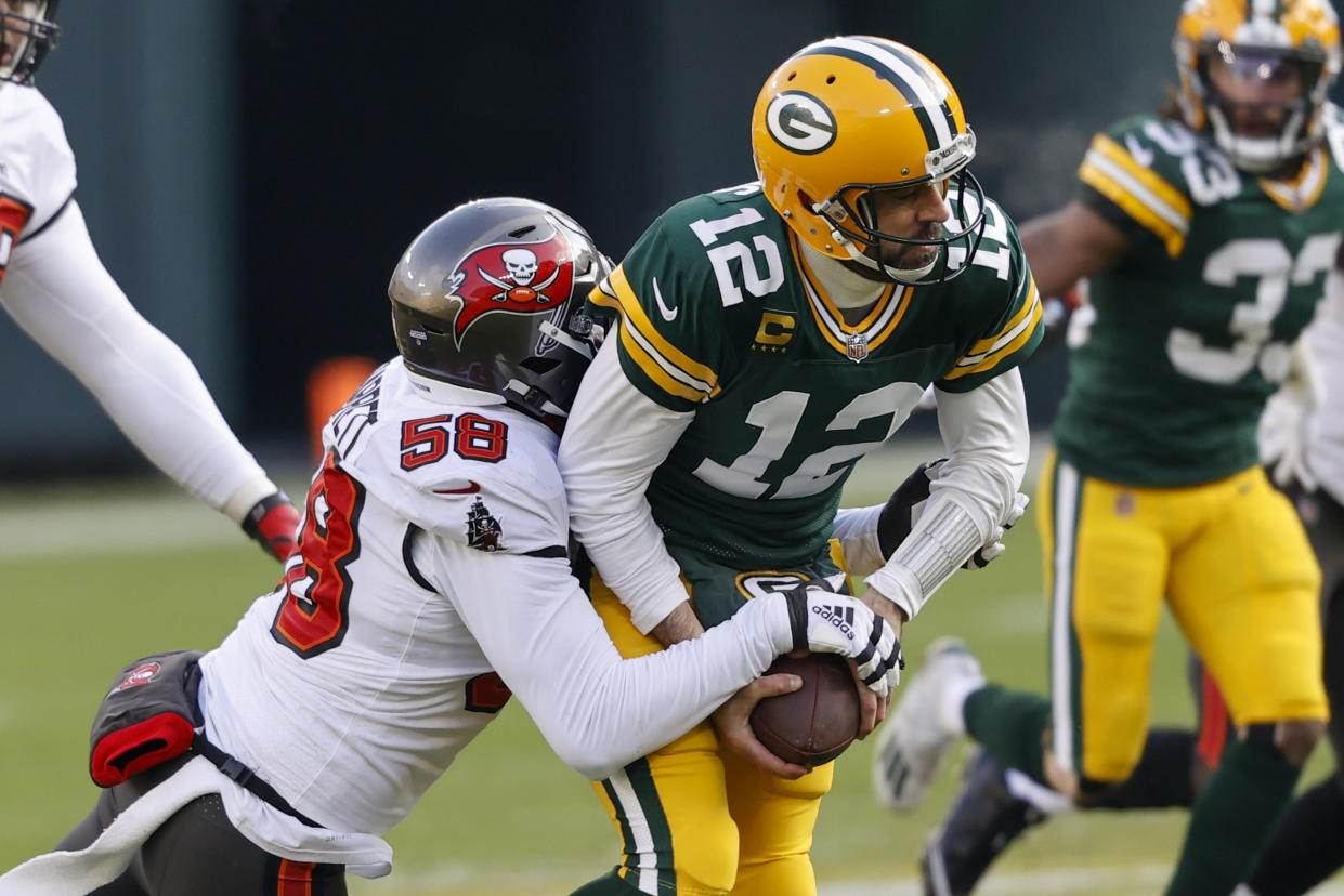 Buccaneers pass rusher Shaquil Barrett (58) sacks Packers quarterback Aaron Rodgers during Sunday's NFC championship game. (AP Photo/Jeffrey Phelps)