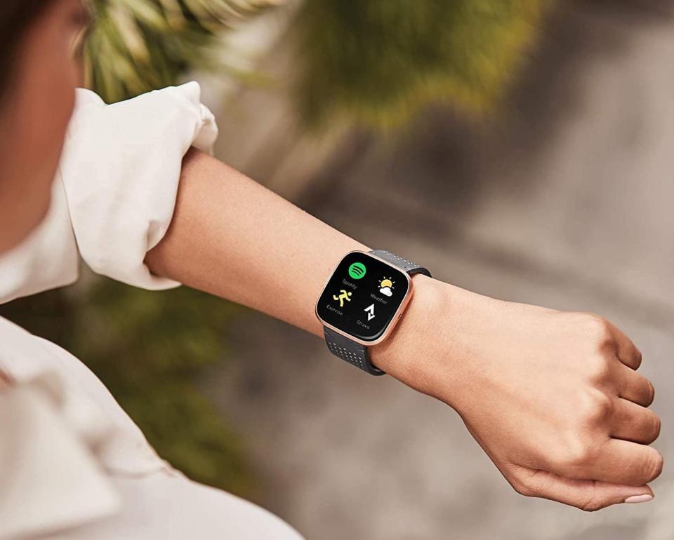 The Fitbit Versa 2 connects to Spotify, weather, workout apps, and more. Image via Amazon.