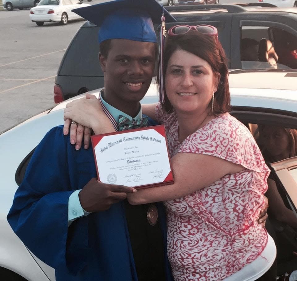 Robert Woods, left, is pictured with Julanne DuBois at his graduation from John Marshall High School in 2015.