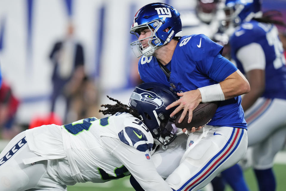 Seattle Seahawks defensive tackle Myles Adams (95) sacks New York Giants quarterback Daniel Jones (8) during the fourth quarter of an NFL football game, Monday, Oct. 2, 2023, in East Rutherford, N.J. (AP Photo/Frank Franklin II)