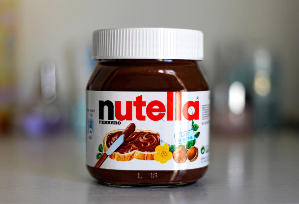 Paris, France - February 22, 2012: Jar of Nutella Hazelnut on a bokeh background. Nutella is the brand name of a chocolate hazelnut flavored sweet spread by the Italian company Ferrero.