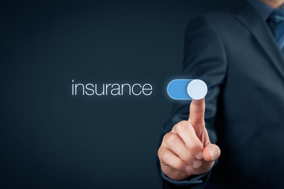 A man touching a virtual button that says "insurance".
