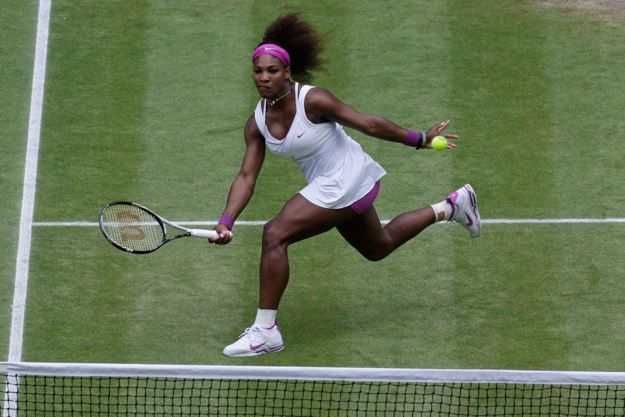 Serena Williams of the USA returns the ball during her Ladies’ Singles final match against Agnieszka Radwanska of Poland on day 12 of the Wimbledon in 2012. - Credit: Getty Images