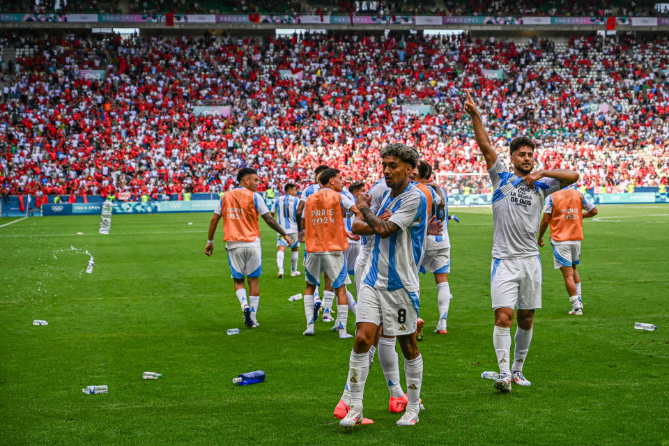 Water bottles thrown towards Cristian Medina.