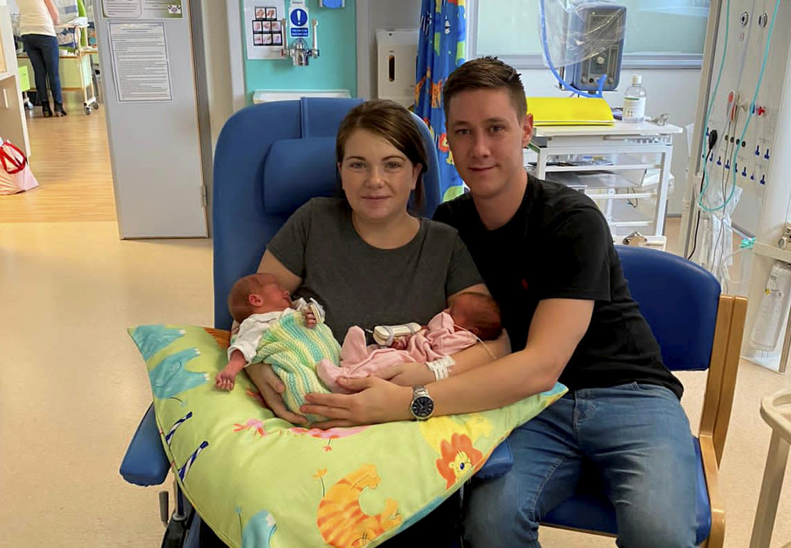 Lorna Whiston with new born twins Reuben and Arya and partner Jonny Parkes. (SWNS)