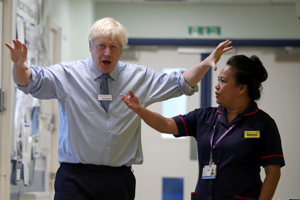 Britain's Prime Minister Boris Johnson (L) gestures during his visit to Whipps Cross University Hospital in Leytonstone, east London on September 18, 2019. (Photo by Yui Mok / POOL / AFP)        (Photo credit should read YUI MOK/AFP/Getty Images)