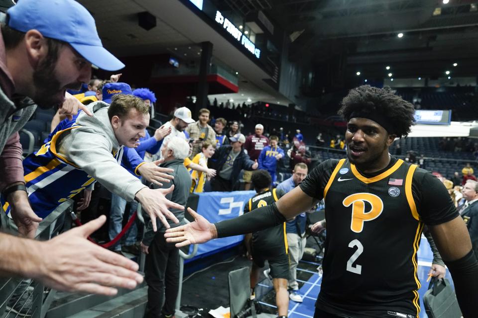 Pittsburgh's Blake Hinson celebrates with fans after Pittsburgh defeated Mississippi State in a First Four game in the NCAA men's college basketball tournament Tuesday, March 14, 2023, in Dayton, Ohio. (AP Photo/Darron Cummings)