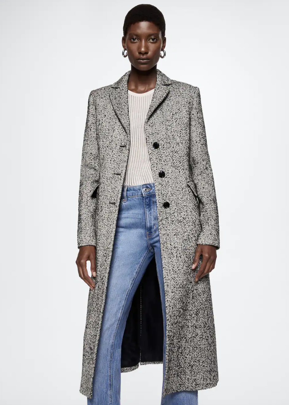 model wearing blue jeans and grey Fitted Coat with Buttons (photo via Mango)