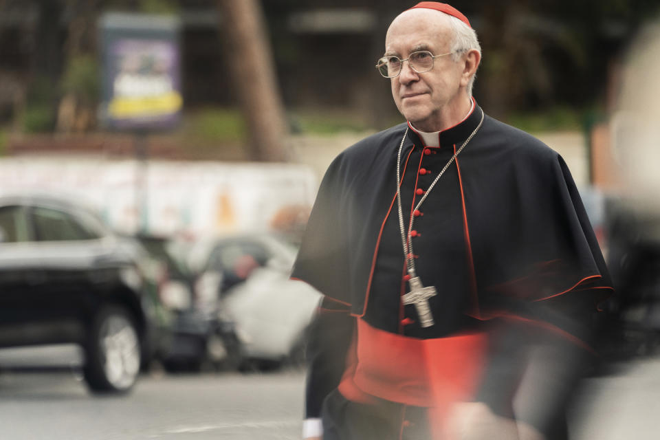 This image released by Netflix shows Jonathan Pryce as Cardinal Bergoglio in a scene from "The Two Popes." On Monday, Jan. 13, Pryce was nominated for an Oscar for best actor for his role in the film. (Peter Mountain/Netflix via AP)