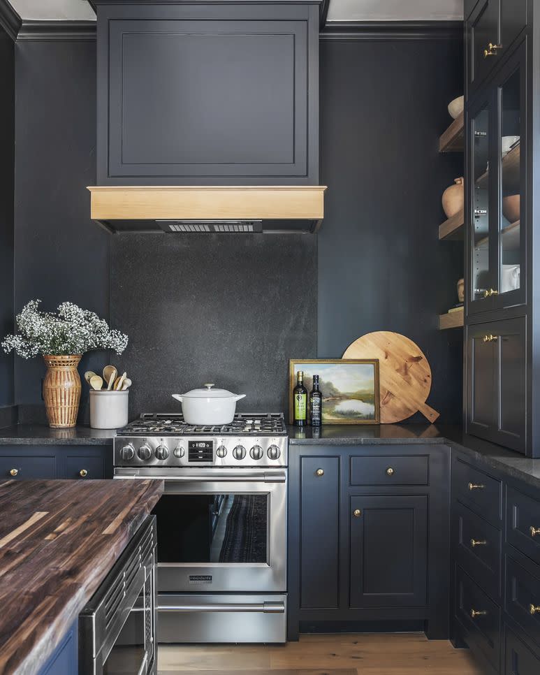 oklahoma designer kelsey leigh mcgregor used charcoal gray negresco granite on the backsplash and countertops of this kitchen so they would nearly disappear against the dark paint paint after midnight, kelly moore paints range frigidaire professional art vintage