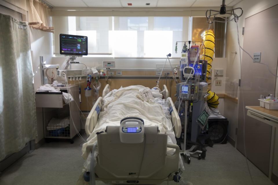 A COVID patient in a negative-pressure room inside the ICU