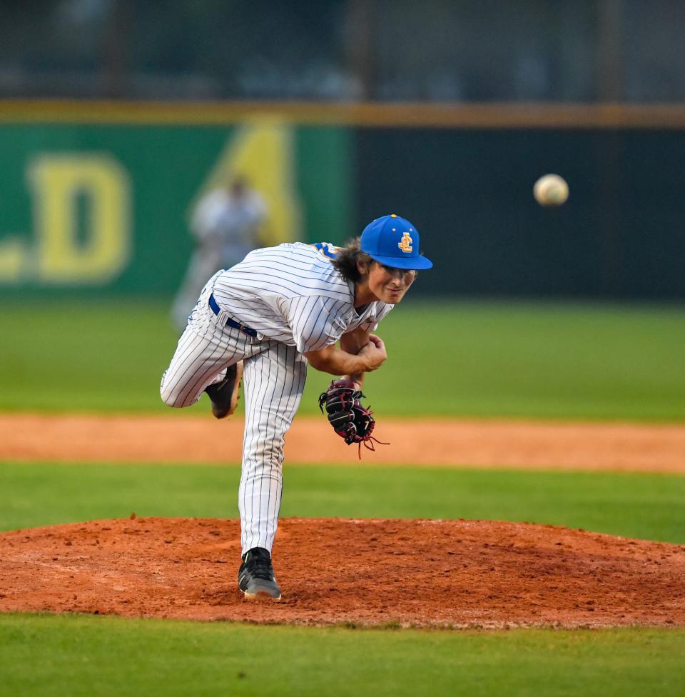 John Carroll Carroll Catholic’s Taggert Cameron (7) de,overs a pitch to the plate in a high school baseball game against South Fork, Thursday, Feb. 29, 2024, in Fort Pierce.