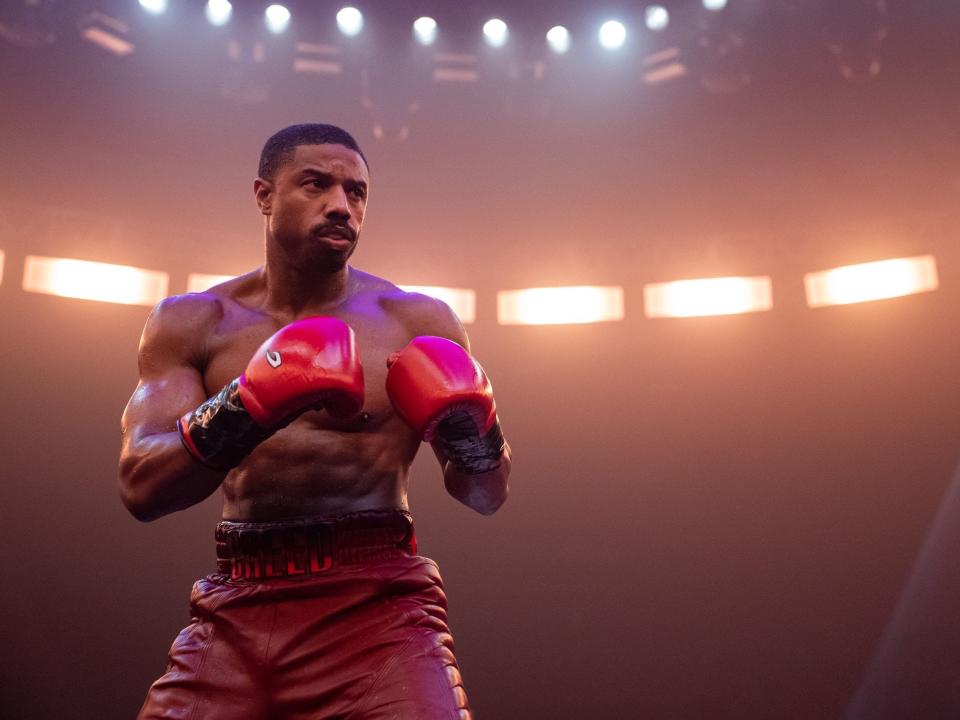 Michael B. Jordan wearing boxing gloves