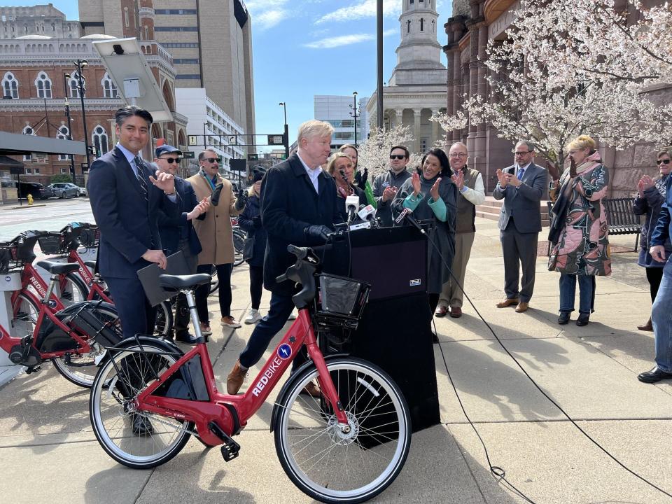 Red Bike supporters, led by Cincinnati City Councilman Mark Jeffreys, at the podium, are putting together a plan to reopen the 10-year-old bike-share service.