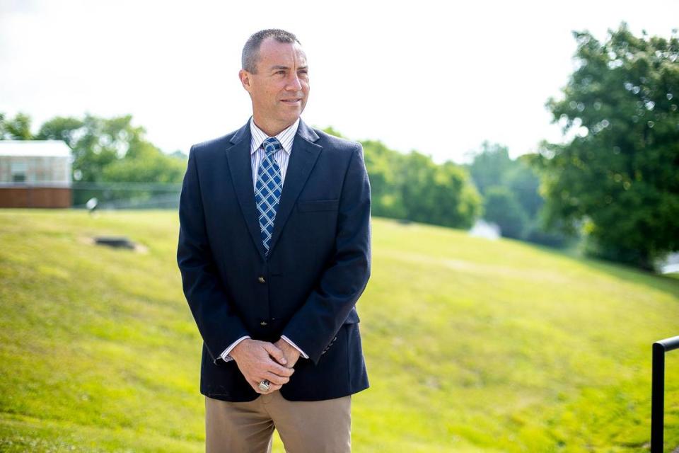 Mercer County School superintendent Jason Booher poses for a portrait outside the school district’s central office in Harrrodsburg on July 2, 2021, his second day in the job.