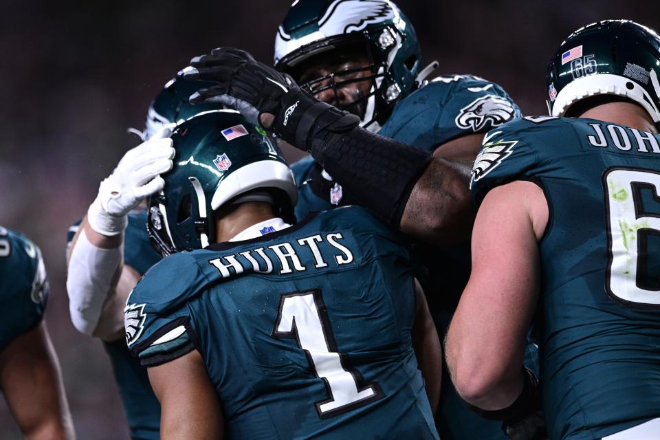 Philadelphia Eagles quarterback Jalen Hurts (1) celebrates his touchdown with teammates during the first half of an NFL football game against the Minnesota Vikings on Thursday, Sept. 14, 2023, in Philadelphia. (AP Photo/Derik Hamilton)