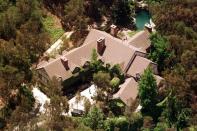 The 6 Bedroom $1.75 Million Dollar Home of George Clooney. It has a private swimming pool and basketball court as well as acess to the Santa Monica Mountains. George stores a selection of vintage cars in the garage of this home.