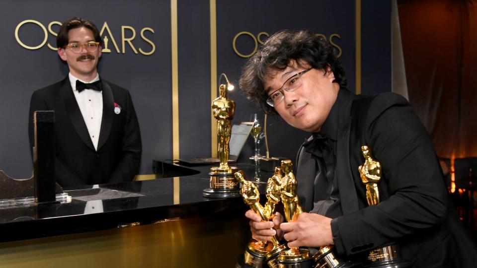 Bong Joon-ho with his multiple Oscars