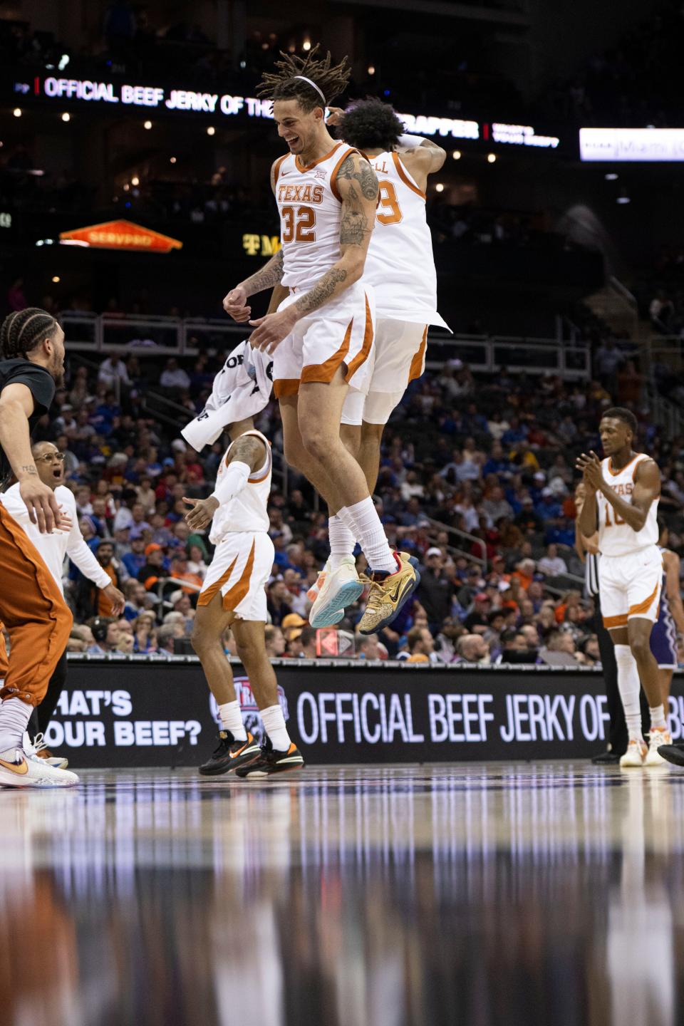 Texas forwards Christian Bishop and Dillon Mitchell celebrate a play during the Longhorns' win over TCU during the Big 12 Tournament. The Longhorns, who went on to beat Kansas in the title game, enter this week's NCAA Tournament with a lot of momentum. They're a No. 2 seed.