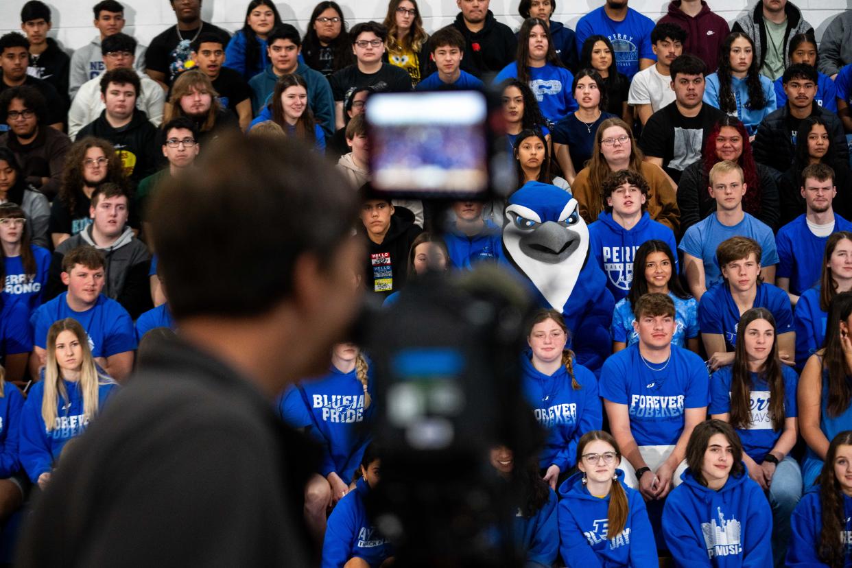 Students at Perry High School cheer for the camera during filming of a "Good Morning America" segment Friday, April 12, 2024, at Perry High School. The junior and senior classes at Perry were awarded $50,000 by JCPenney for their dream prom.