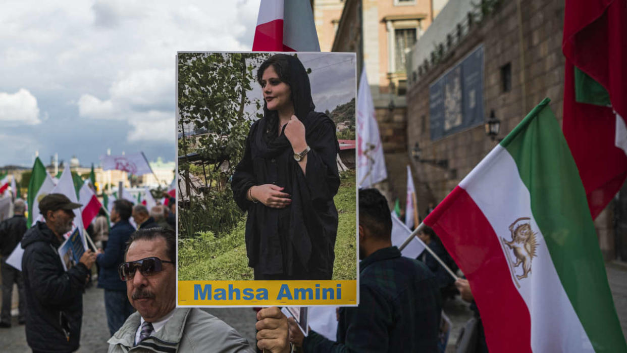 People protest outside the Swedish Parliament in Stockholm, Sweden, on September 24, 2022, following the death of an Iranian woman after her arrest by the country's morality police in Tehran. - Protests in Iran following the death of a young woman arrested by morality police could signal 