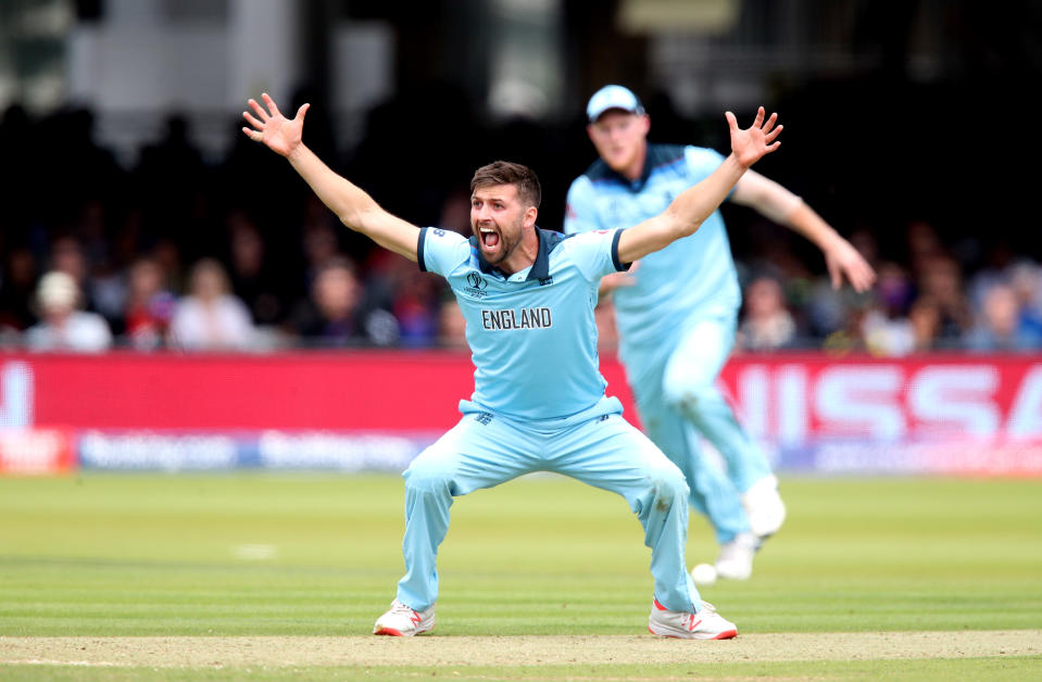 England's Mark Wood celebrates taking the wicket of Ross Taylor by LBW during the ICC World Cup Final at Lord's, London.