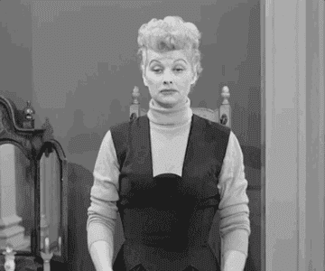 Lucy from "I Love Lucy" shrugging