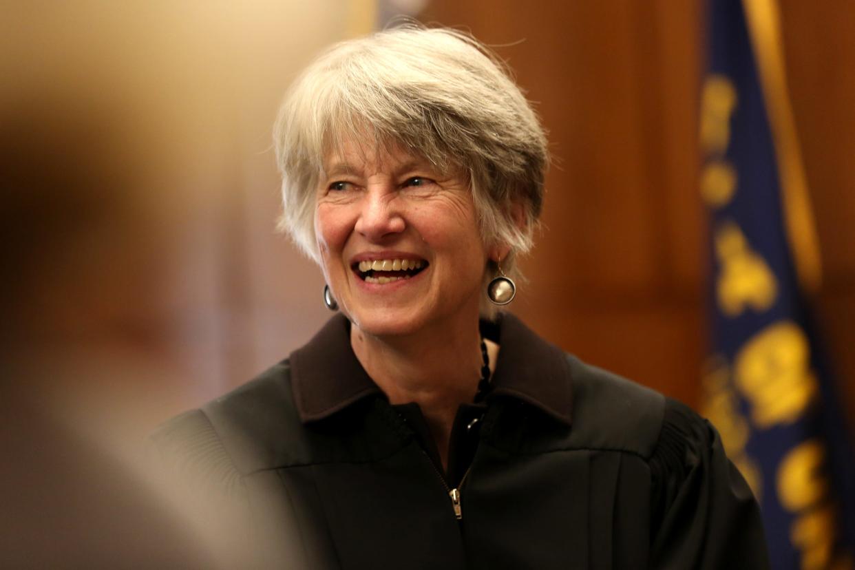 Oregon Supreme Court Chief Justice Martha Walters talks to people during a swearing in ceremony at the Oregon State Capitol in Salem in April 2019.