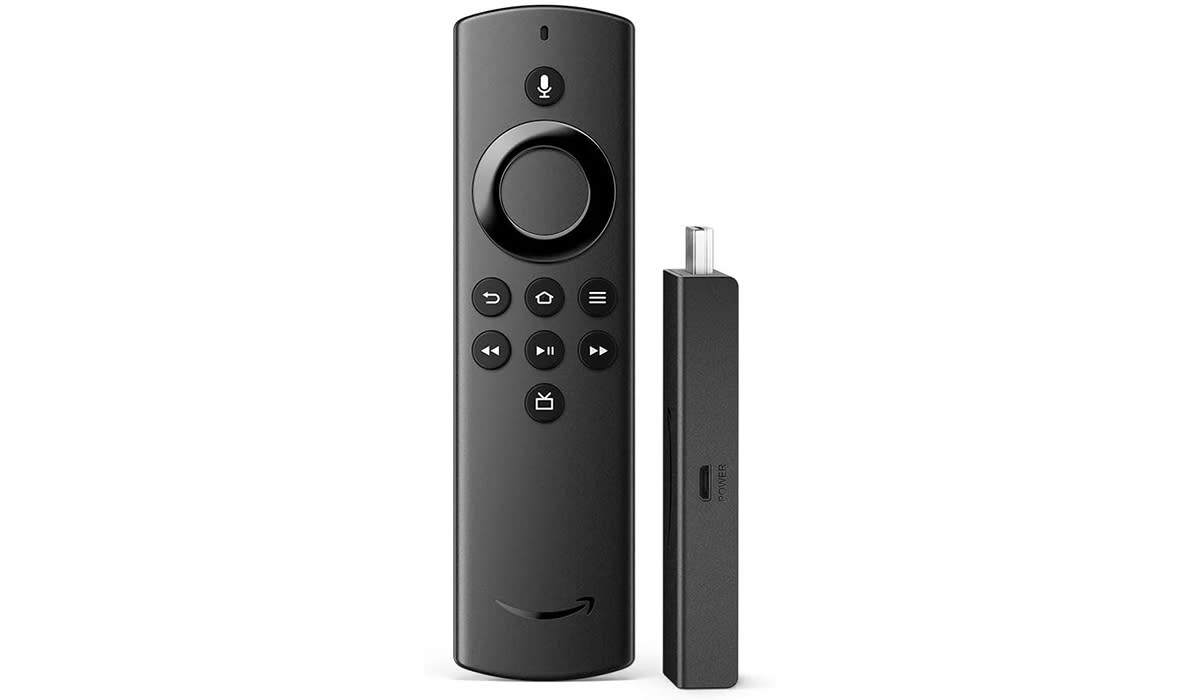 A remote control next to a streaming stick