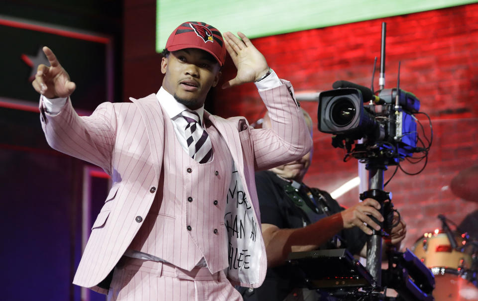 Oklahoma quarterback Kyler Murray waves after the Arizona Cardinals selected Murray in the first round at the NFL football draft, Thursday, April 25, 2019, in Nashville, Tenn. (AP Photo/Mark Humphrey)