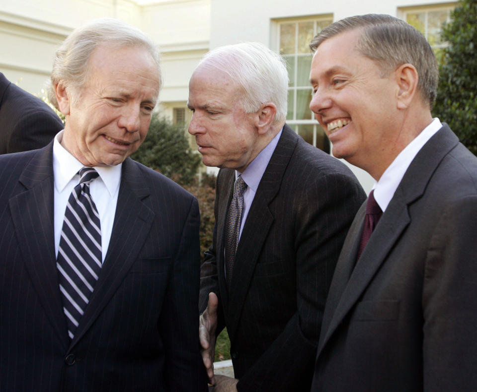 McCain confers with Sens. Joe Lieberman (D-Conn.) and Lindsey Graham (R-S.C.) during remarks to the press outside the West Wing of the White House in Washington on Dec. 16, 2005. The senators were often referred to as the "three amigos."