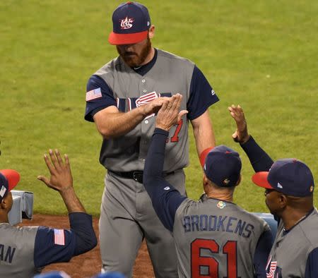 Mar 22, 2017; Los Angeles, CA, USA; United States pitcher Sam Dyson (47) gets high-fives after pitching the 7th inning against Puerto Rico during the 2017 World Baseball Classic at Dodger Stadium. Robert Hanashiro-USA TODAY Sports