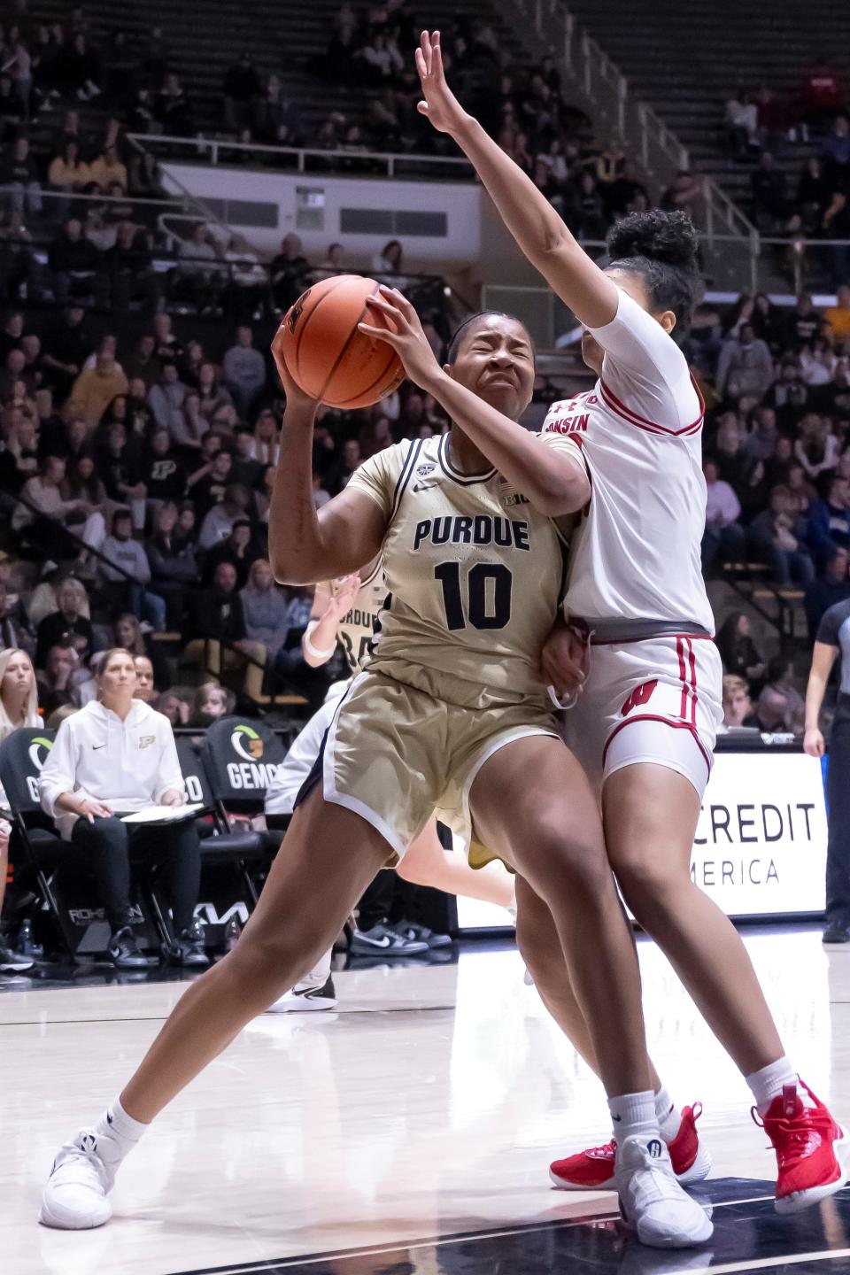 Purdue Boilermakers guard Jeanae Terry (10) takes contact on a drive during the NCAA women’s basketball game against the Wisconsin Badgers, Saturday Dec. 30, 2023, at Mackey Arena in West Lafayette, Ind. Purdue won 89-50.
