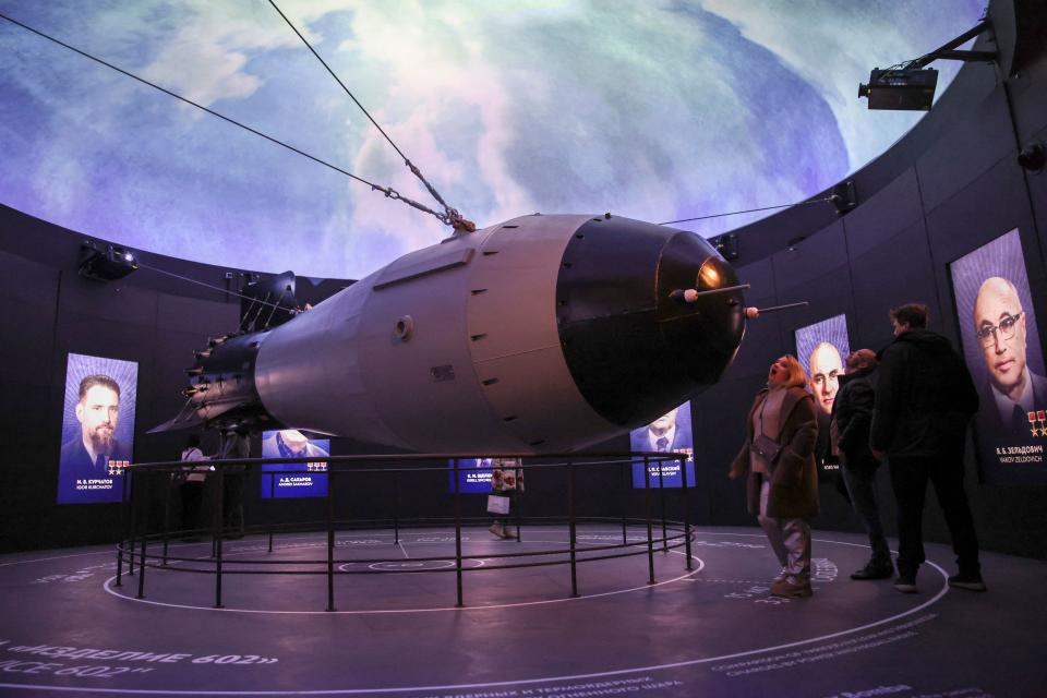 Visitors look at a model of a Soviet AN-602 thermonuclear aerial bomb also known as the Tsar Bomb, the most powerful nuclear weapon ever created and tested, in Moscow on Nov. 4, 2023.