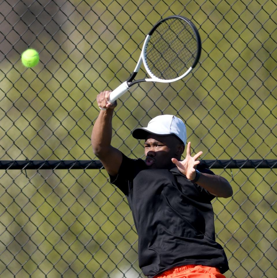 Hoover's Hunter Holloway plays No. 1 singles against GlenOak's Dylan Wiles on Monday.