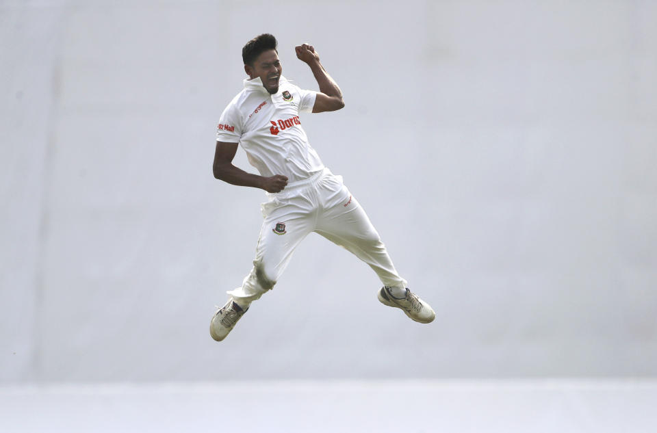 Bangladesh's Taijul Islam leaps in the air to celebrate the wicket of India's Shubman Gill on the day two of the second cricket test match between Bangladesh and India, in Dhaka, Bangladesh, Friday, Dec. 23, 2022. (AP Photo/Surjeet Yadav)