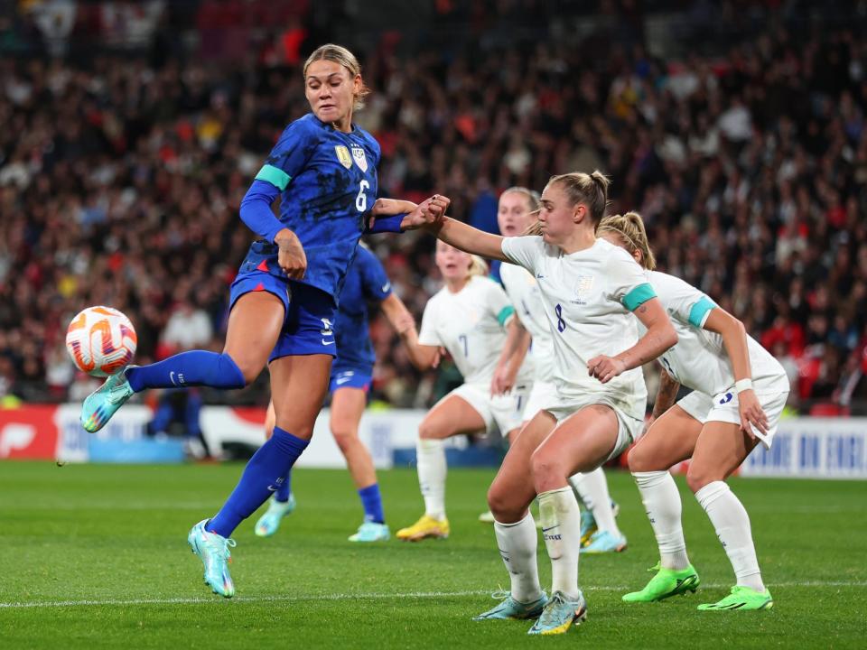 Trinity Rodman flicks the ball against England.