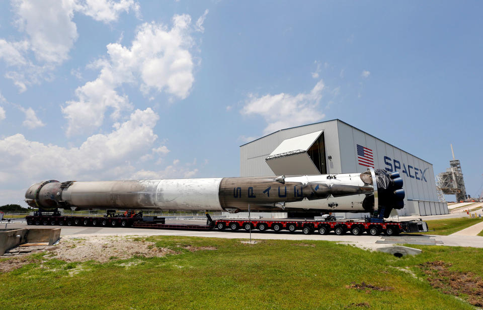 The recovered first stage of a SpaceX Falcon 9 rocket is transported to the SpaceX hangar at launch pad 39A at the Kennedy Space Center in Cape Canaveral