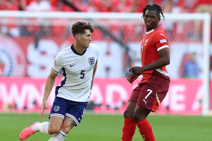 John Stones of England and Breel Embolo of Switzerlandduring the UEFA EURO 2024 quarter-final match