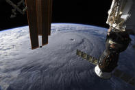 <p>This image provided by NASA on Wednesday, Aug. 22, 2018 shows Hurricane Lane as seen from the International Space Station. The National Weather Service says the hurricane will still pack a wallop for Hawaii on Thursday before gradually slowing over the next two days. Early Wednesday, the hurricane was 320 miles (515 kilometers) south of Hilo on Hawaii Island and moving northwest toward other islands. (Photo: NASA via AP) </p>