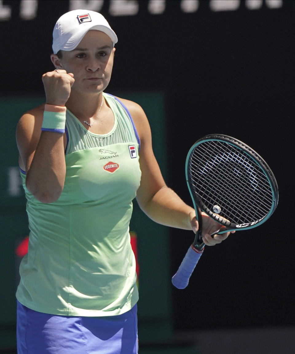 Australia's Ashleigh Barty celebrates after defeating Petra Kvitova of the Czech Republic during their quarterfinal match at the Australian Open tennis championship in Melbourne, Australia, Tuesday, Jan. 28, 2020. (AP Photo/Lee Jin-man)