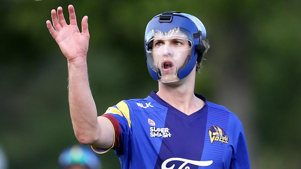 New Zealand-based bowler Warren Barnes, pictured trialling a bowling helmet in 2017. 